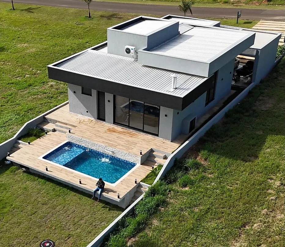 Vista aérea da casa entregue (exibida quando o 3D não carrega)